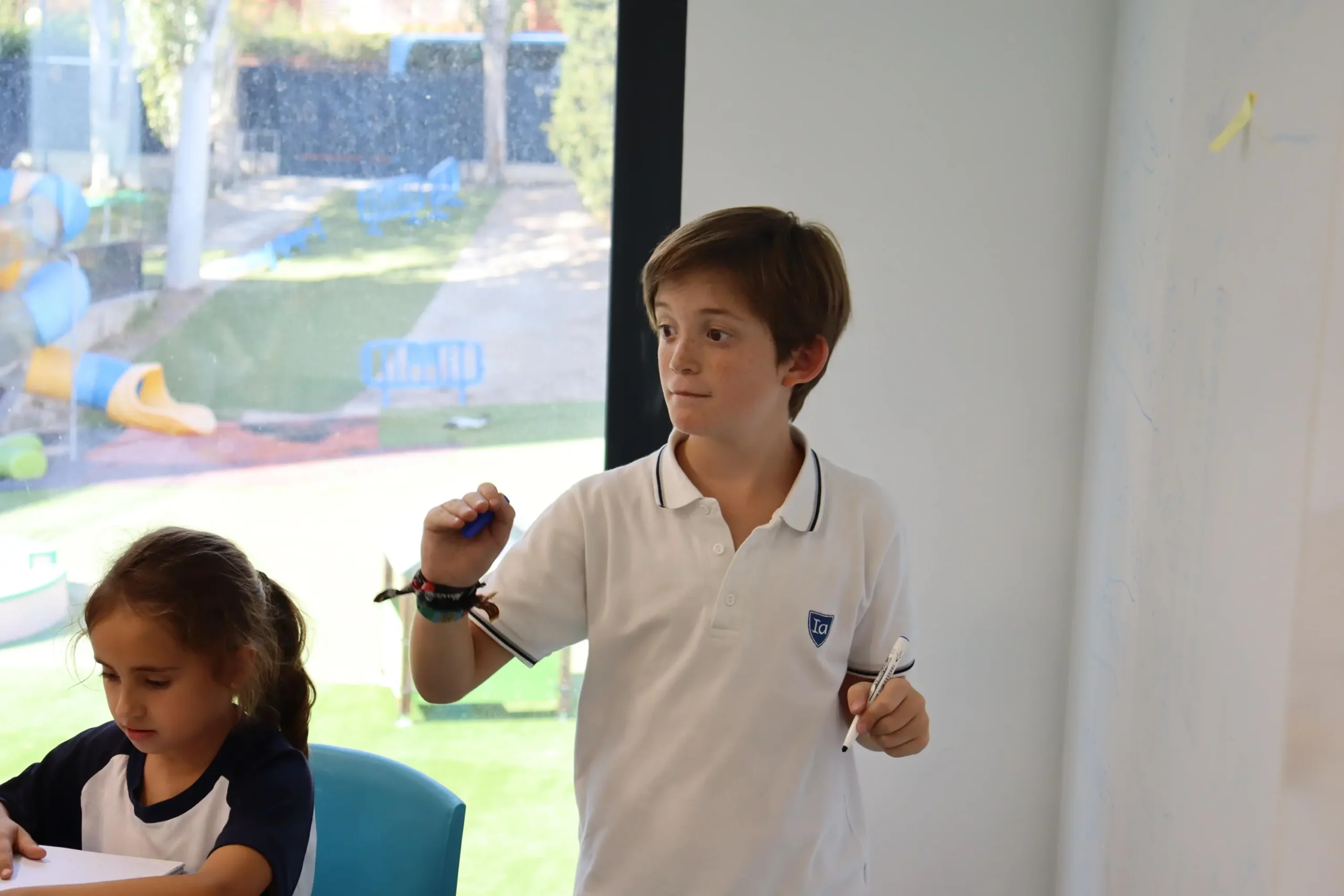 Innovative world schools education, engaged students learning in a modern classroom environment.