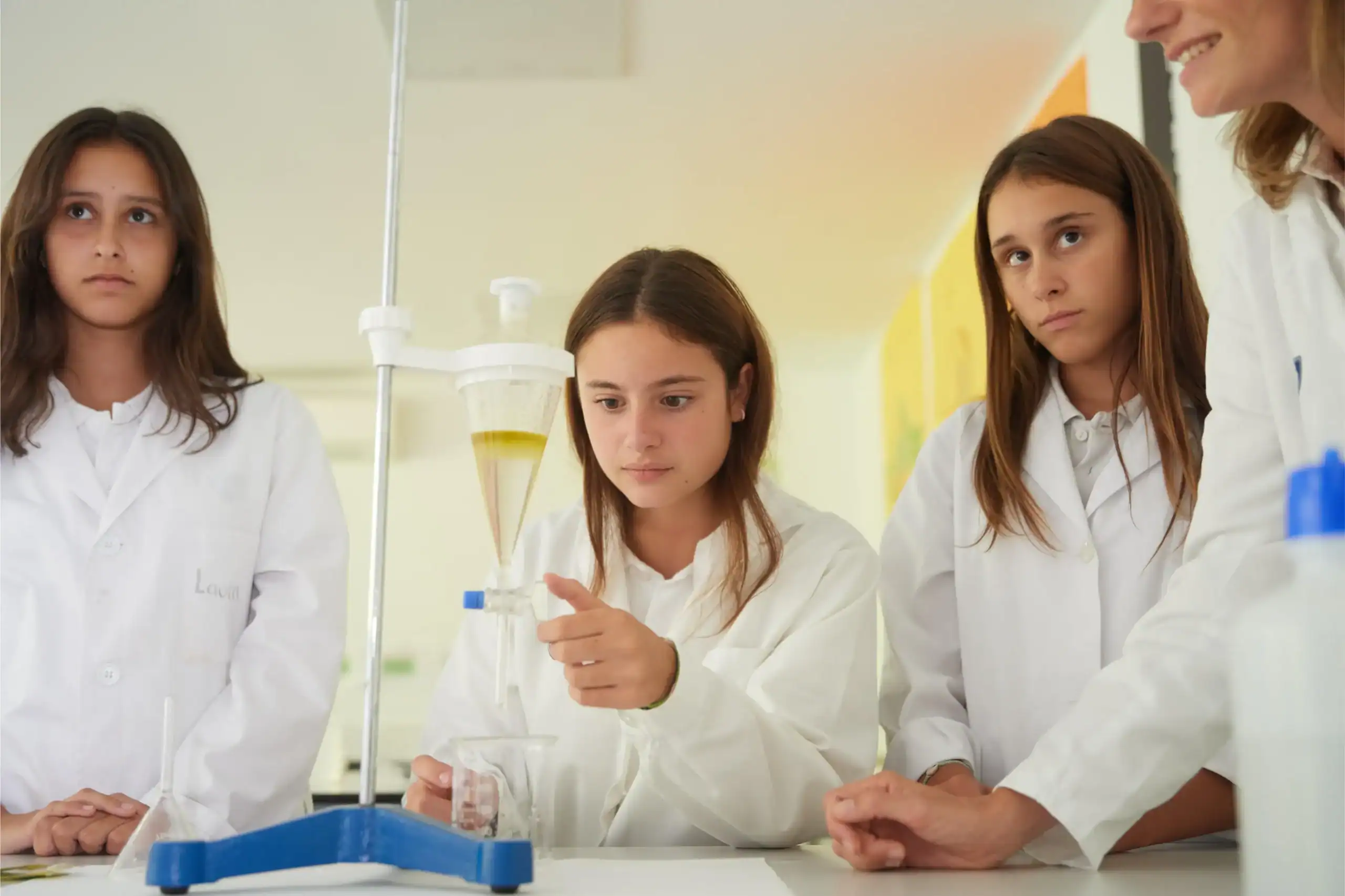 Curious students performing a science experiment in a well-equipped school laboratory.