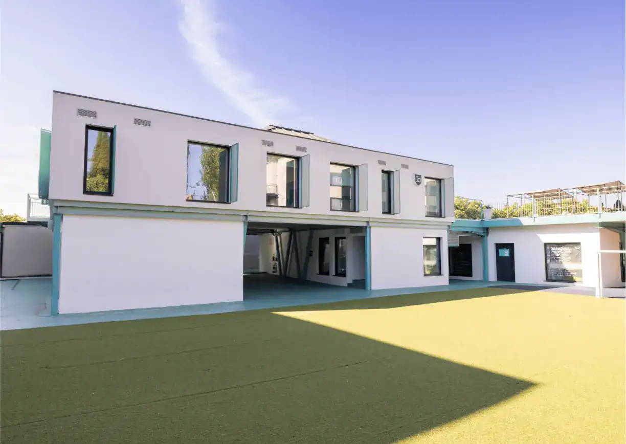 Modern flexible learning school building with open outdoor area, suitable for international education.