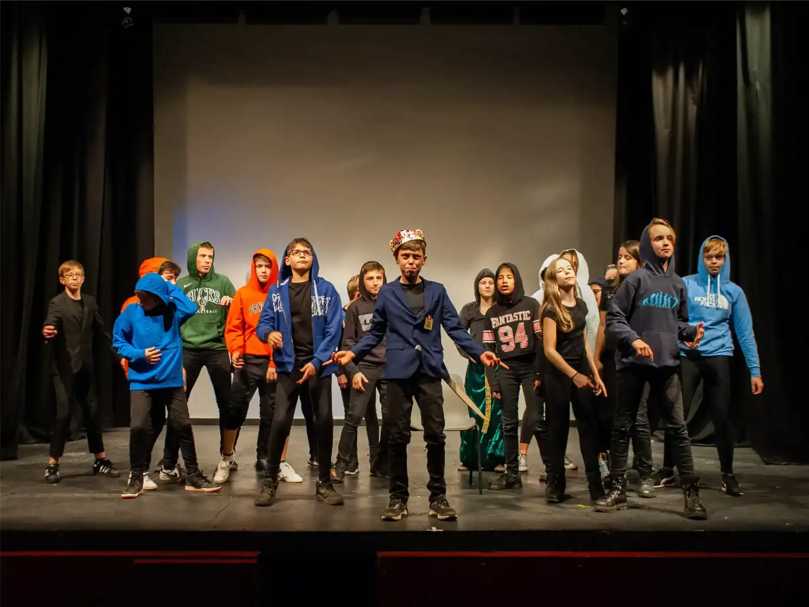 Students performing on stage at St George's International School, Luxembourg.
