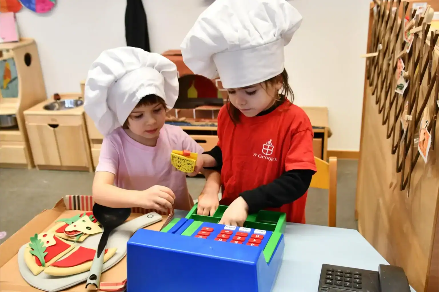 Children cooking in a classroom at St George's International School, Luxembourg.