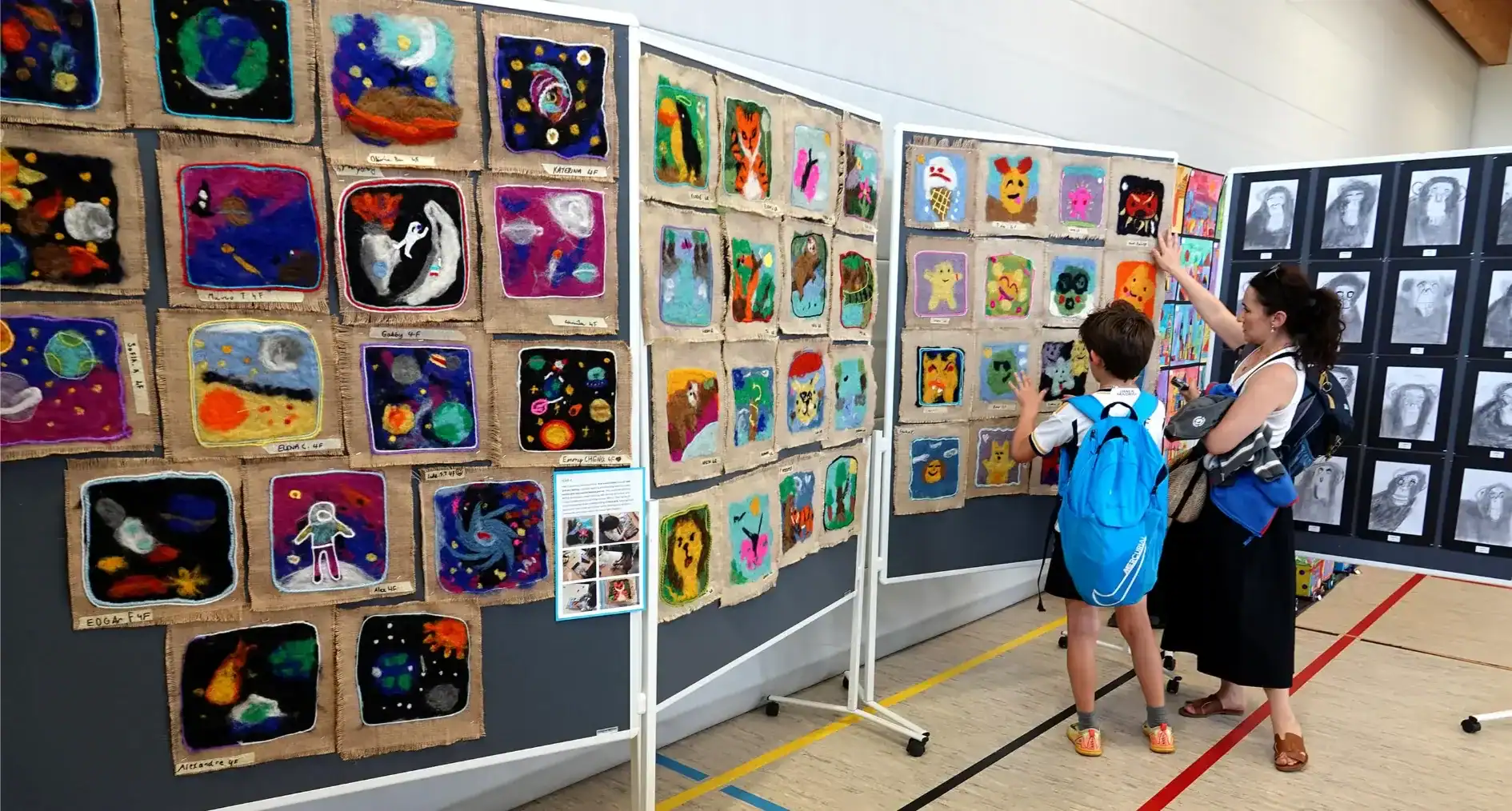 Art display at St George's International School showcasing student artwork in a vibrant school envir.
