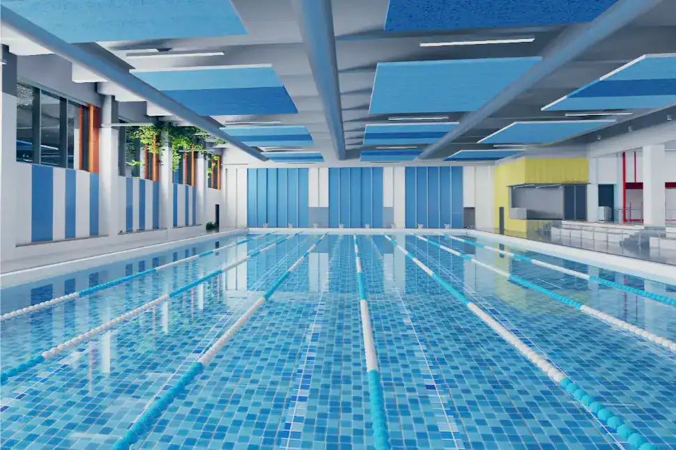 Indoor swimming pool at Dulwich College Bangkok with vibrant blue tiles and spacious design.