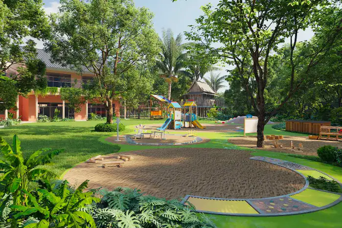 Bright outdoor playground at Dulwich College Bangkok with lush greenery and play equipment.