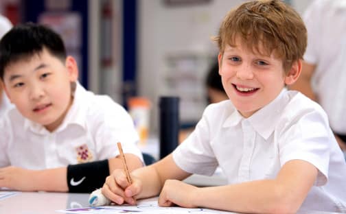 Bright students at Dulwich College Beijing engaging in classroom activities.