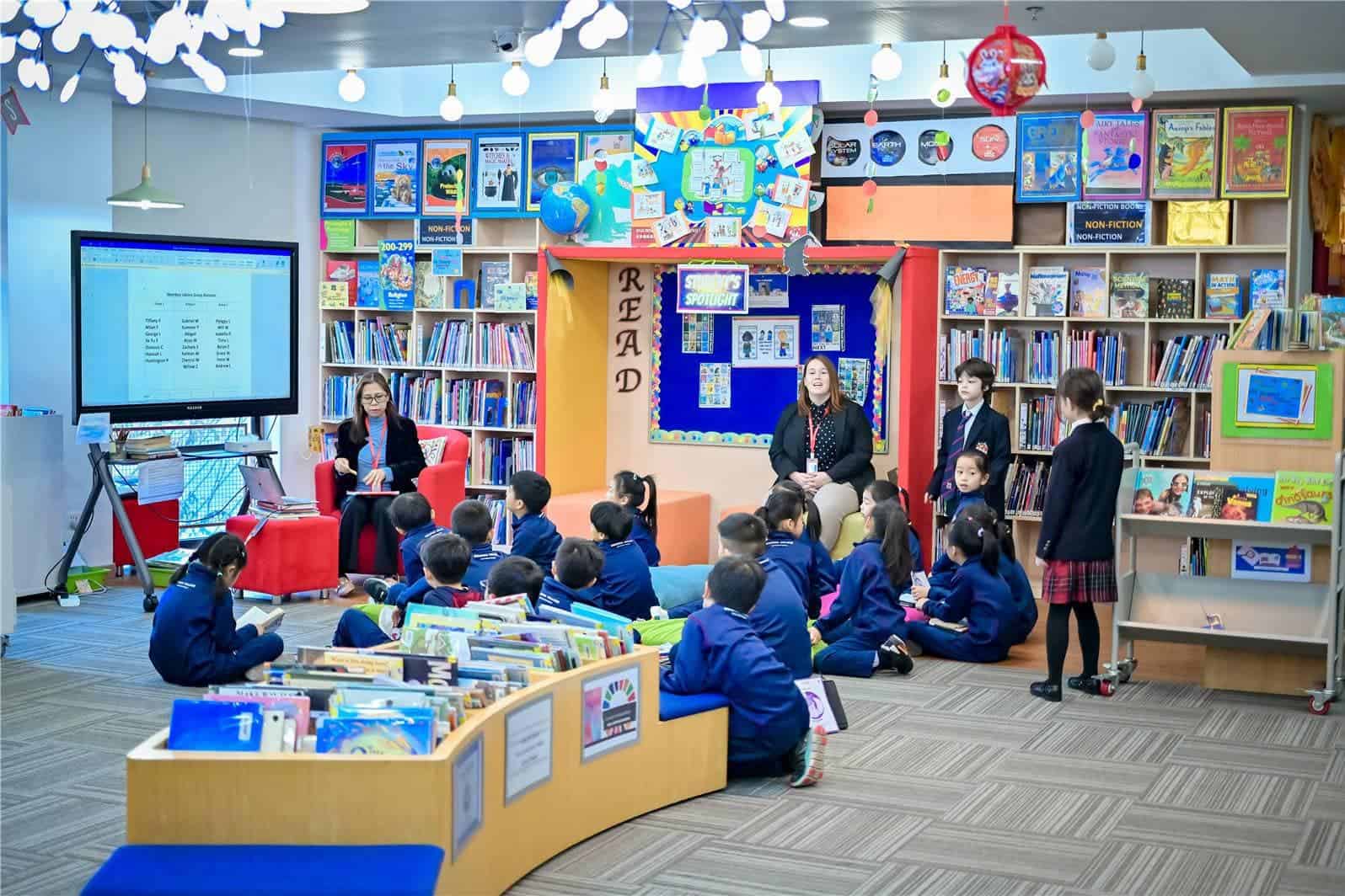 Students attending a reading session at Dulwich College Beijing library.