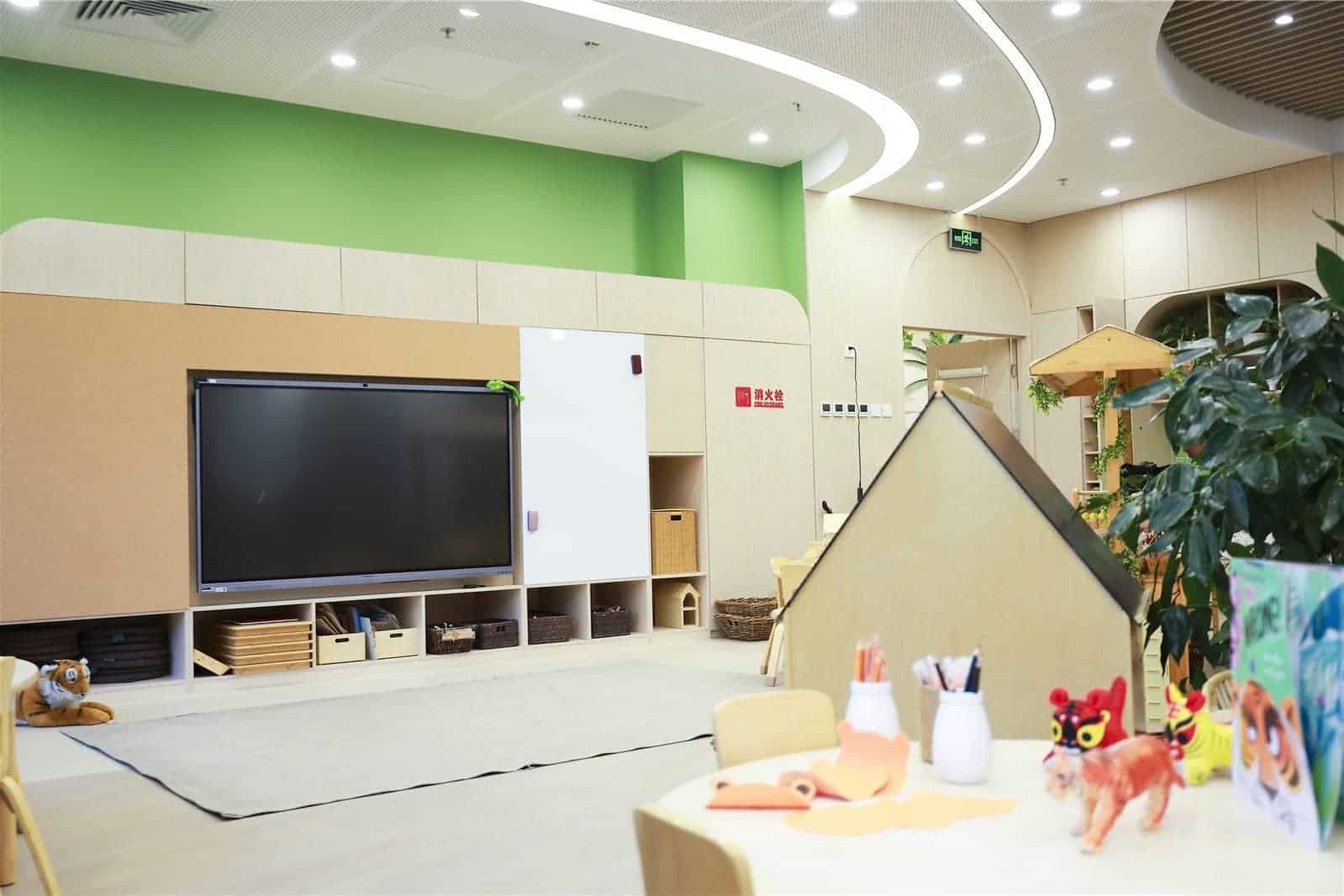 Bright, engaging learning environment with interactive whiteboard and educational toys.