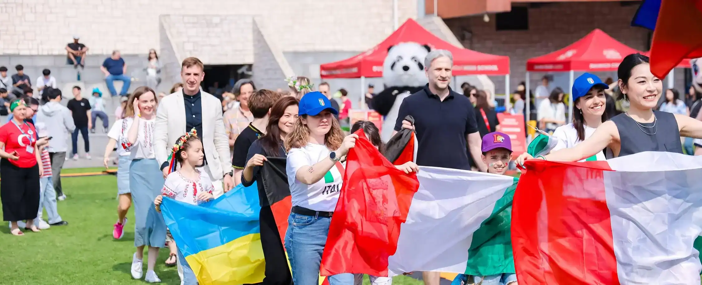 International students celebrate with flags at Dulwich College Suzhou.