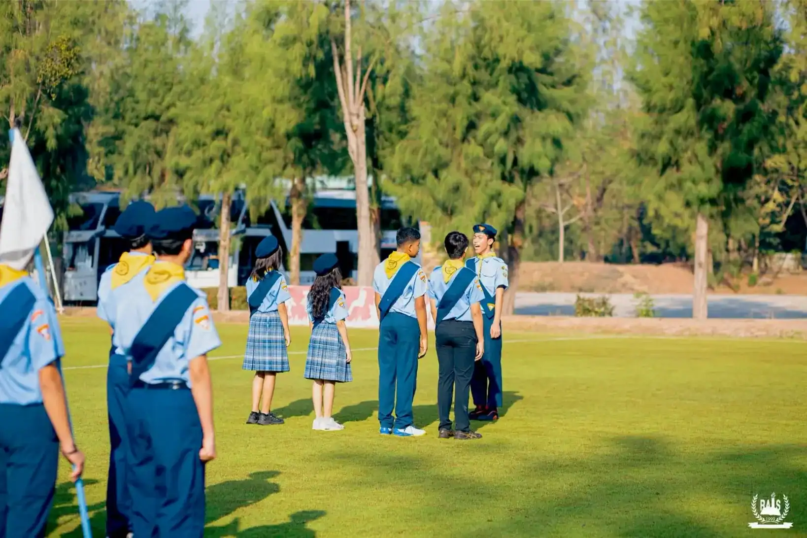Students in uniform participating in outdoor school activities at Ramkhamhaeng Advent International.