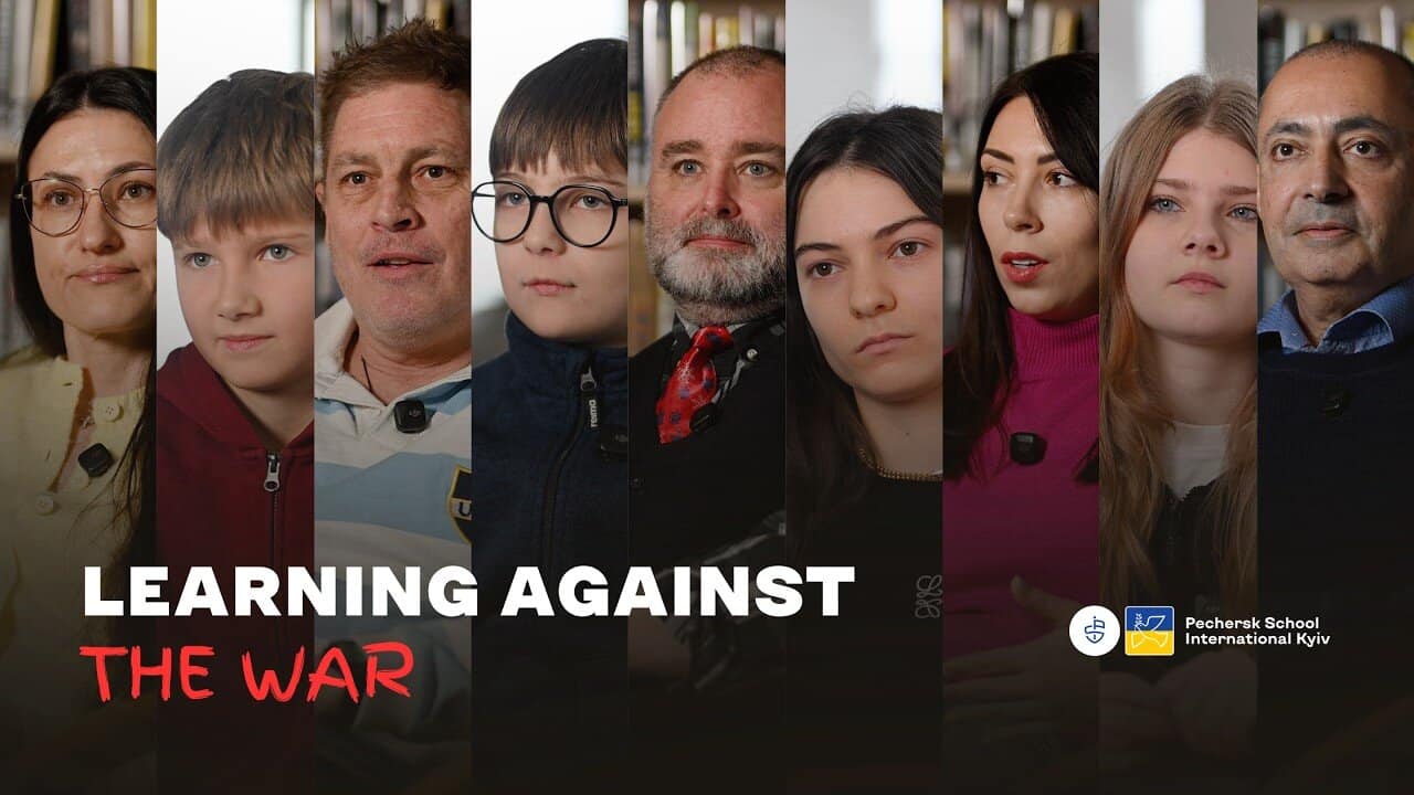 Diverse group of students and teachers discussing educational continuity during wartime at Pechersk.