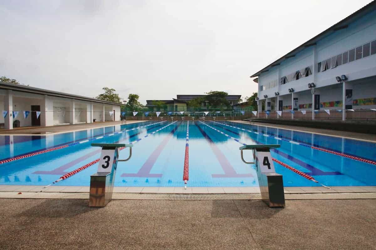 Swimming pool at a modern school facility, ready for students' swim training and competitions.