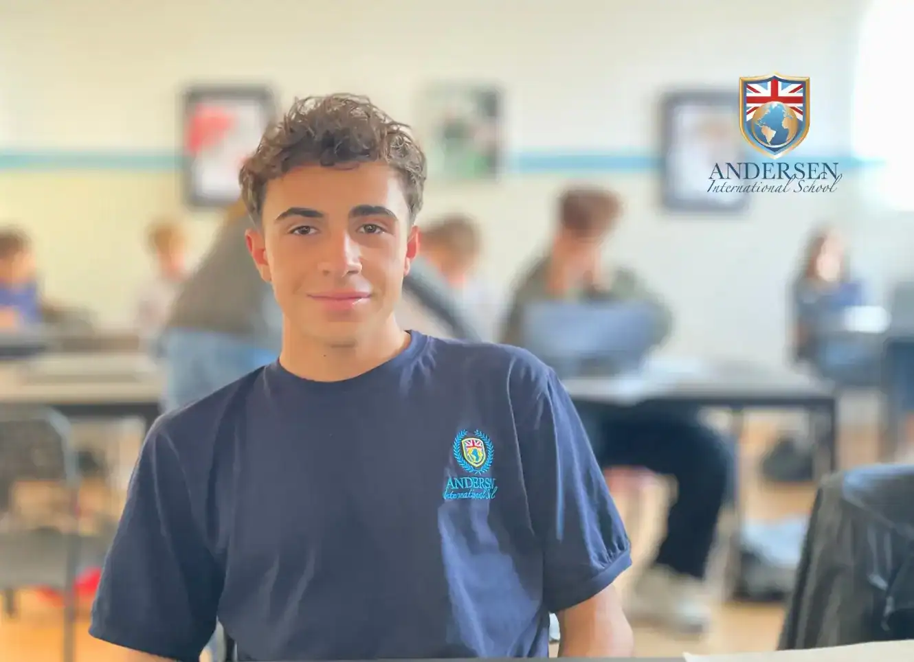 Student in Andersen International School uniform in classroom setting.