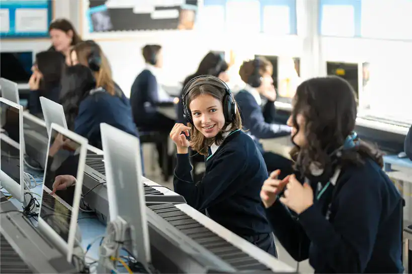 Students in a computer lab at The British School Warsaw, engaging with technology.