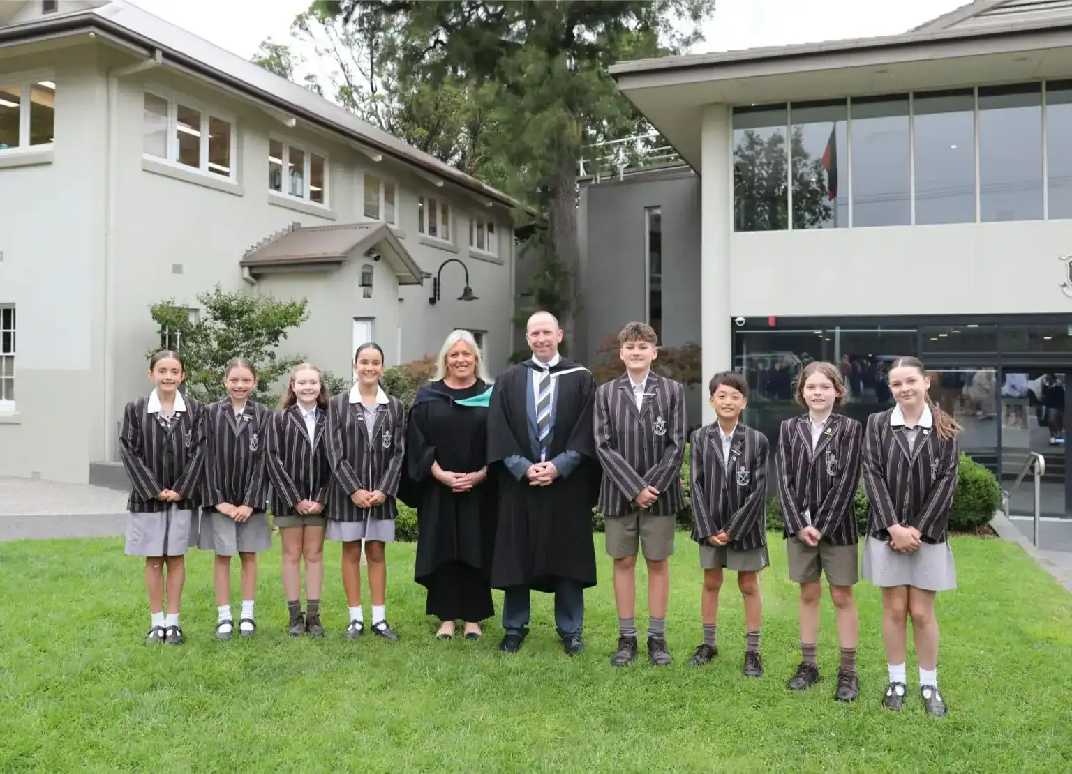 Students and staff outside Ivanhoe Grammar School building.