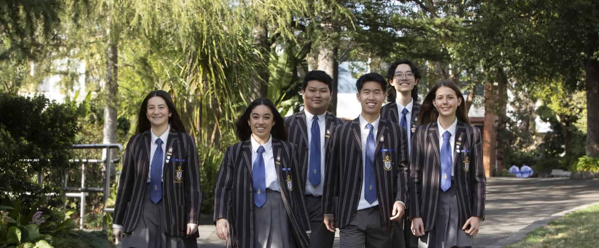 Group of diverse students in school uniforms outdoors at Ivanhoe Grammar School.