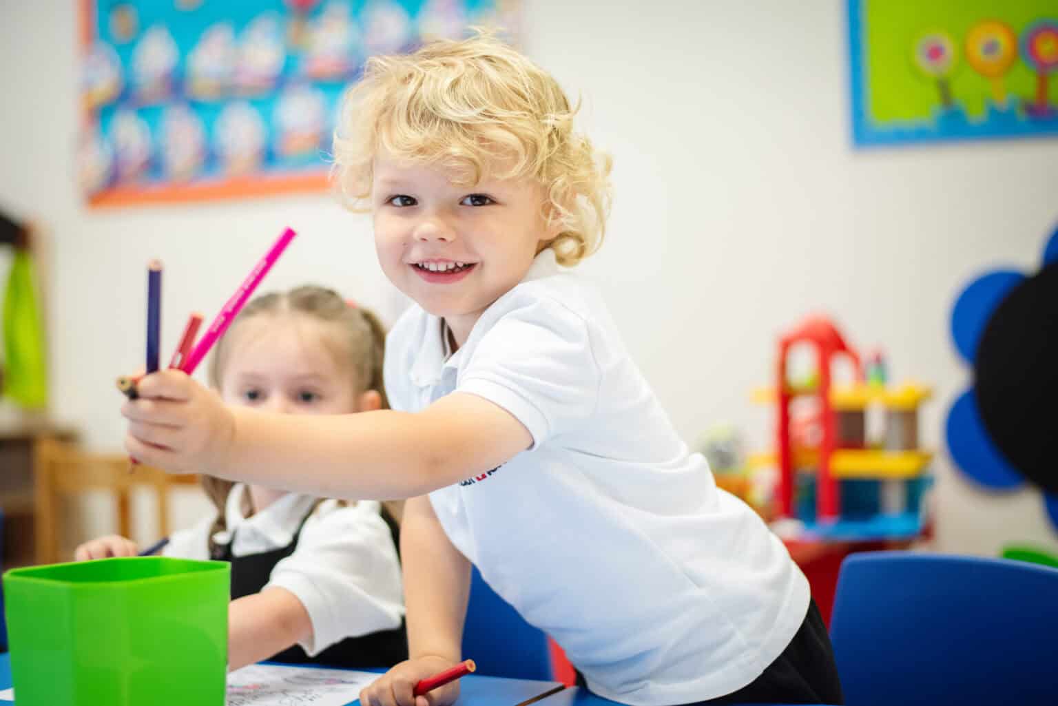 Bright young student engaging in classroom activities at an international school.