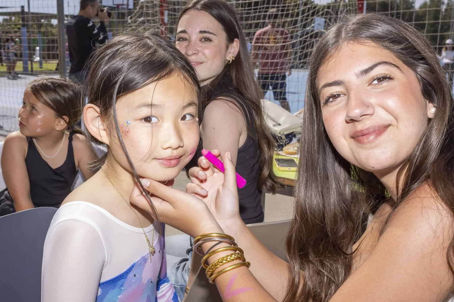 Outdoor event with diverse students at World Schools.