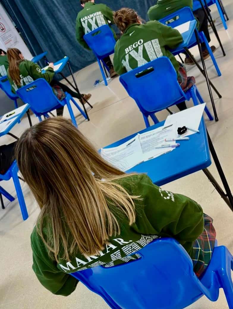 Bright students at international school classroom.