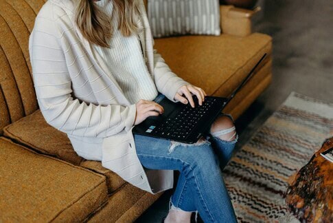 Student using a laptop for online learning at home.