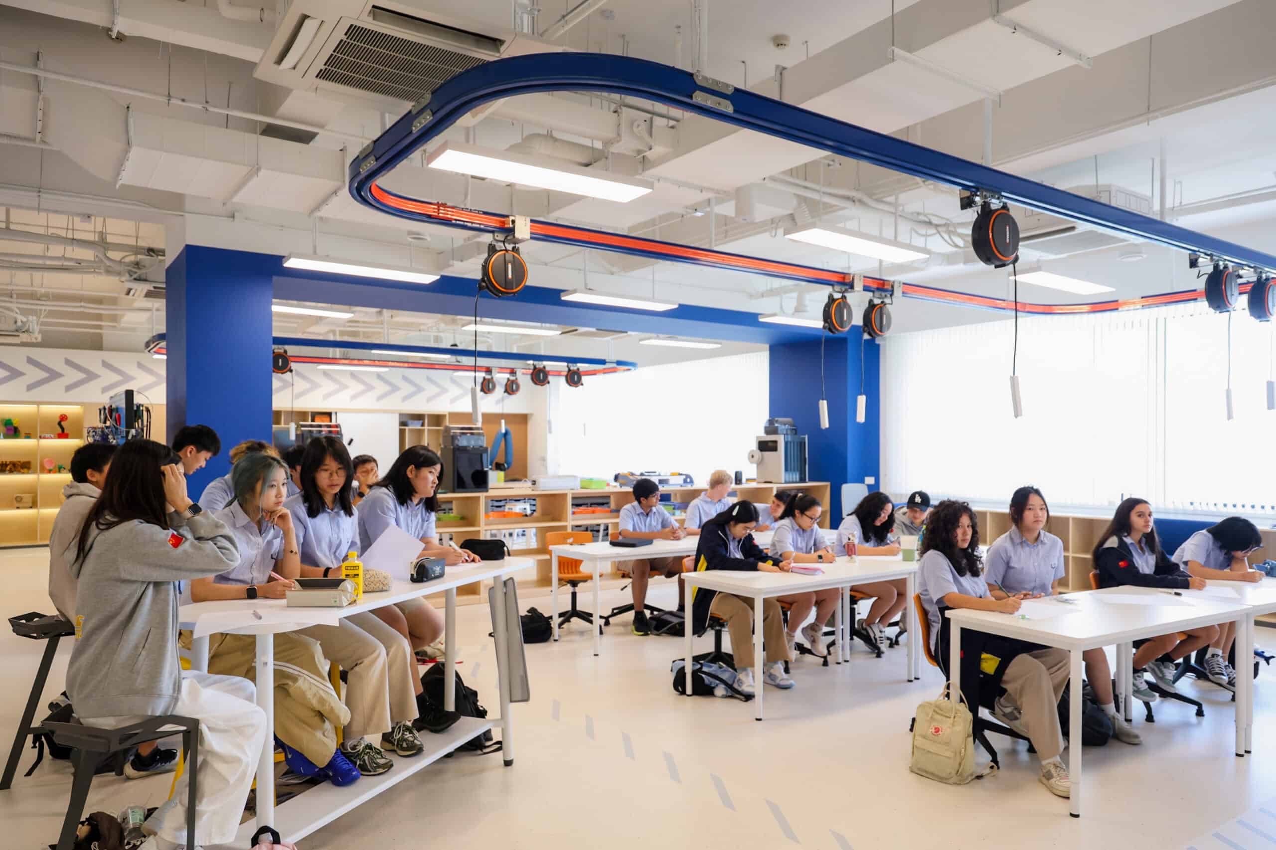Innovative classroom at a world school with students engaged in learning activities, fostering international education excellence.