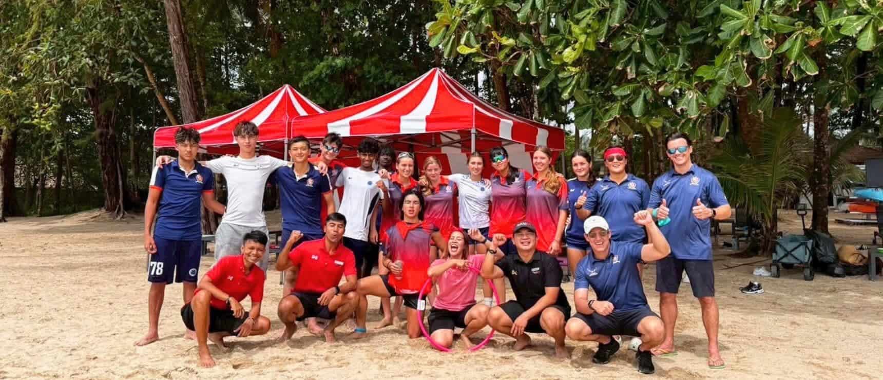 Young diverse students participating in outdoor sports event at World Schools on a sunny day.