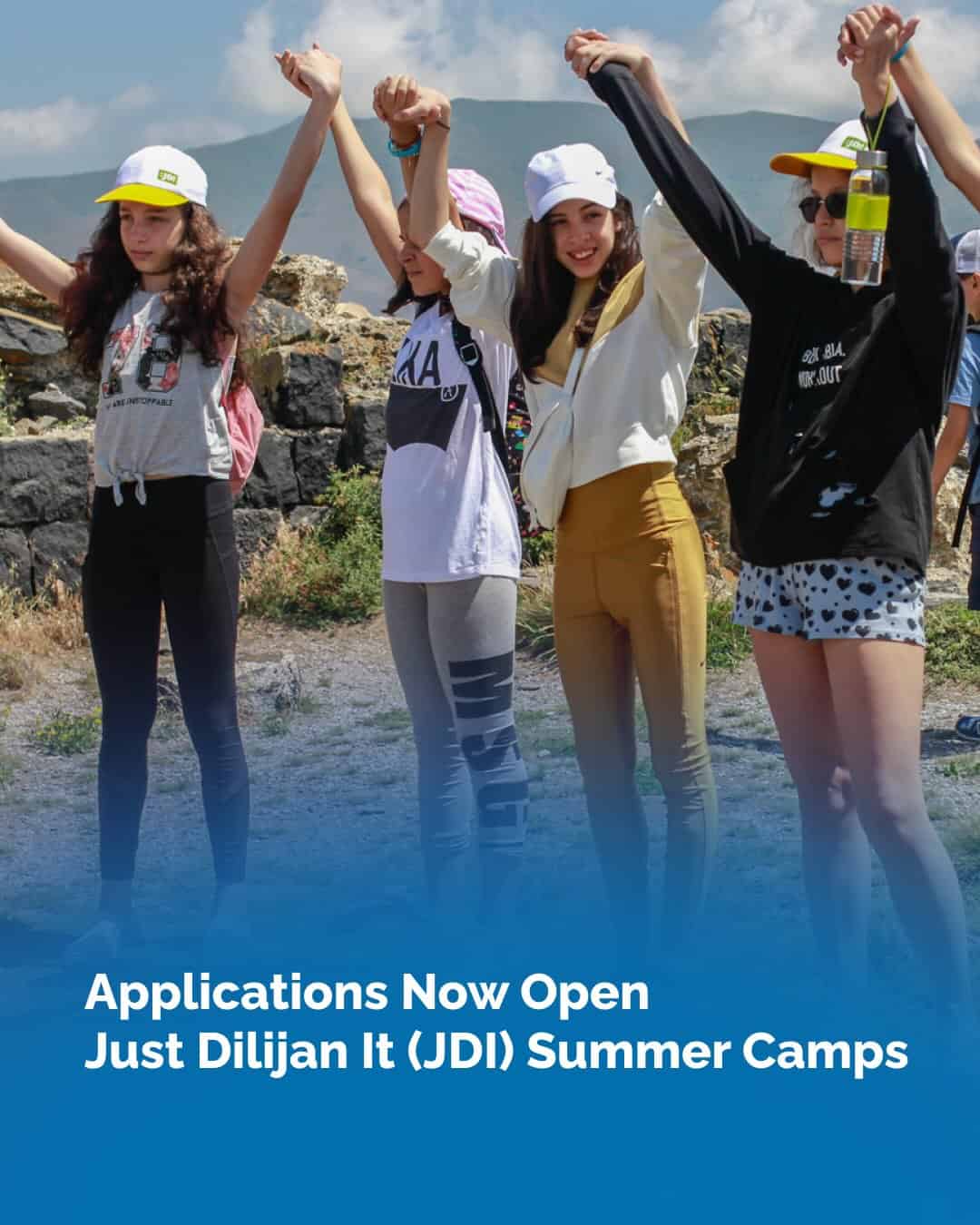 Group of happy students holding hands outdoors at summer camp.