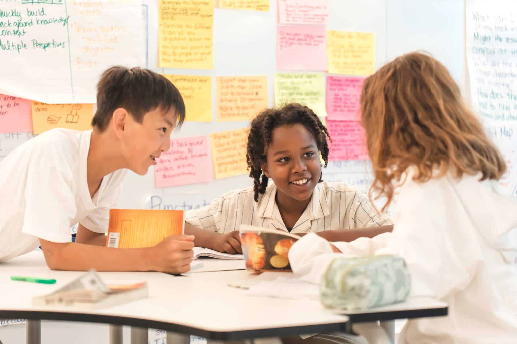 Engaged diverse students collaborating in a modern classroom for global education.