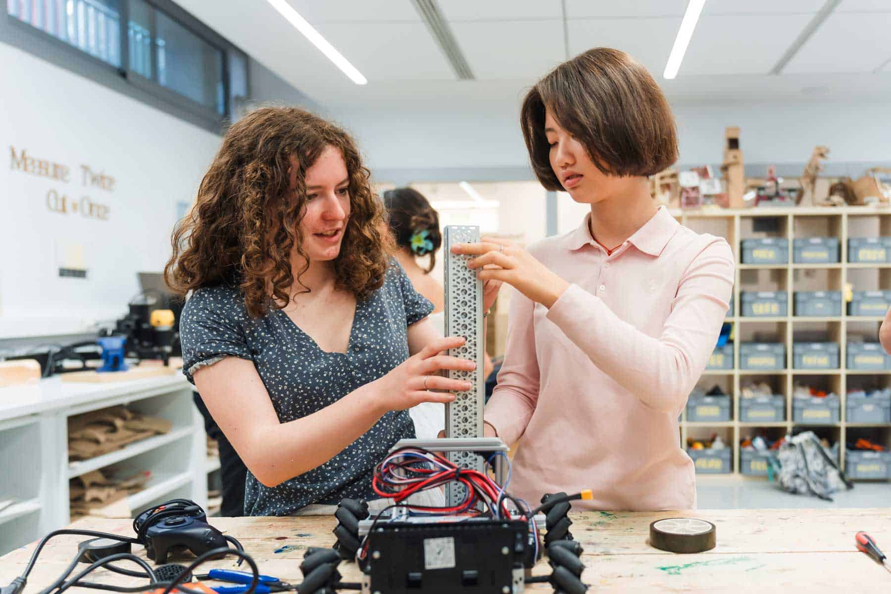 Innovative STEM education at World Schools with students engaging in hands-on robotics projects.