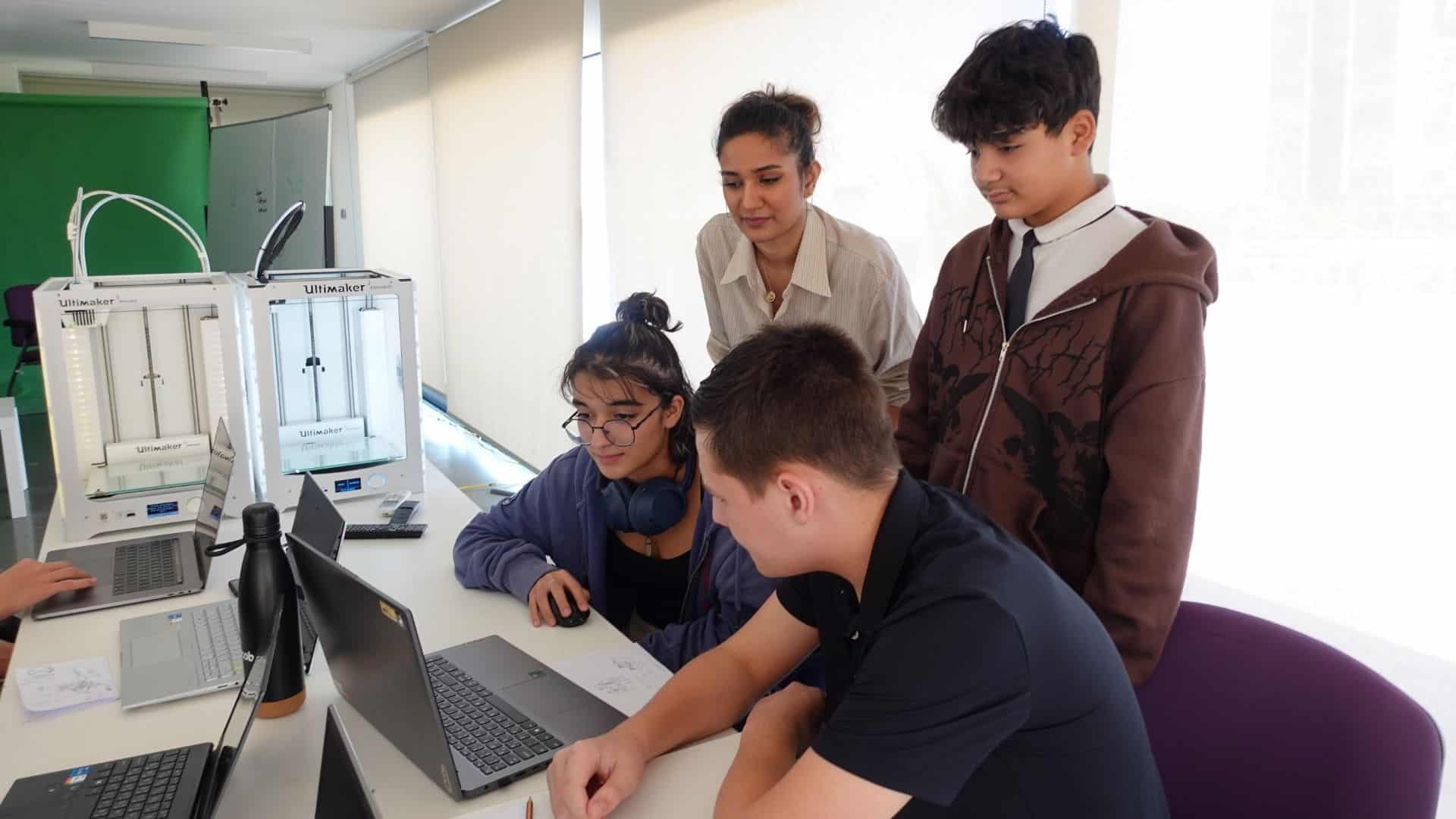 Cutting-edge 3D printing technology classroom at a world schools facility indoors.