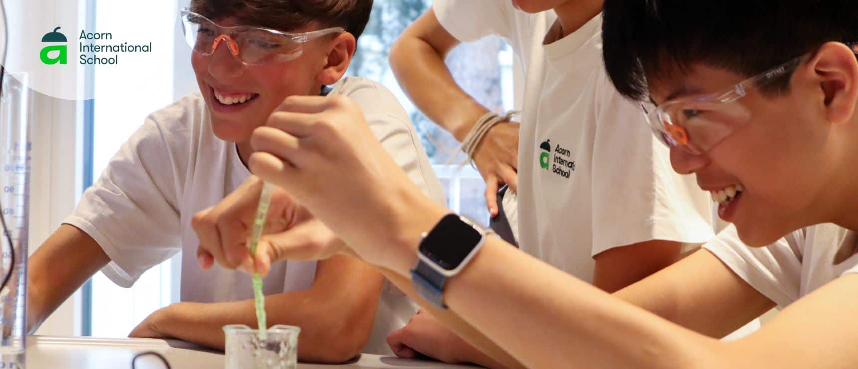 Students conducting science experiment at Acorn International School, showcasing innovative education and hands-on learning.