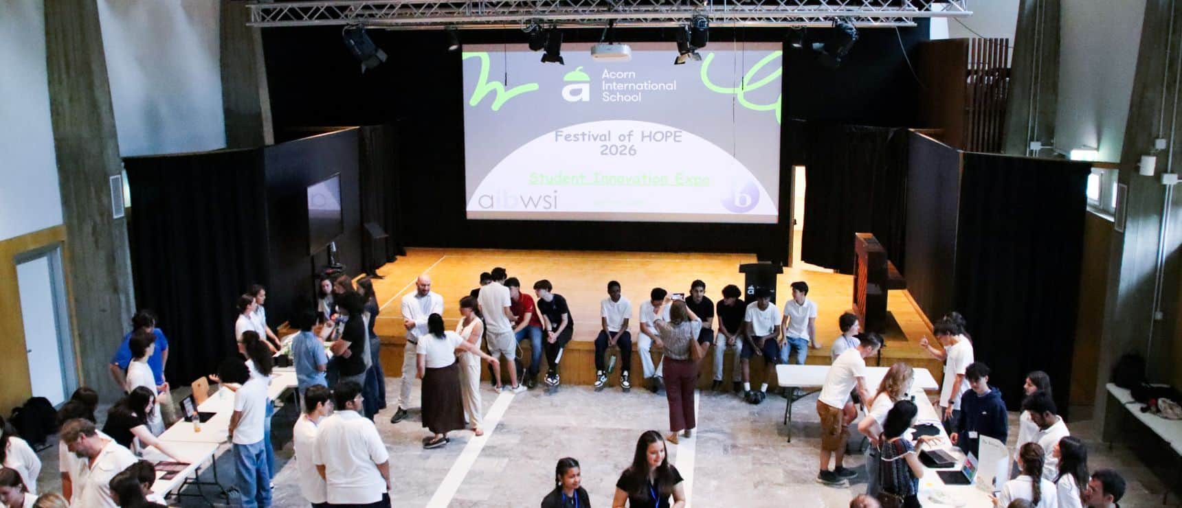 Students attending the World Schools Festival of Hope 2026 event in an auditorium.