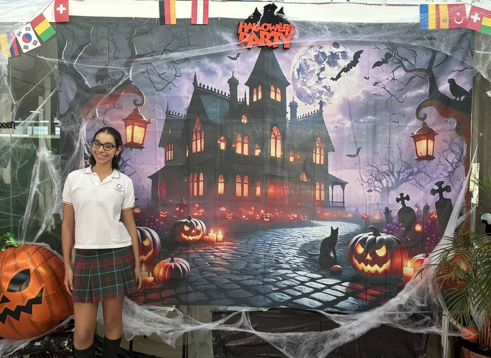 World Schools Halloween backdrop with spooky castle, pumpkins and cobwebs.