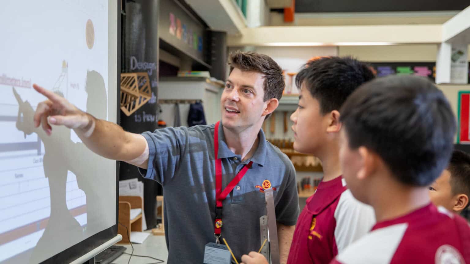 Engaging classroom scene with teacher and students at a world school, focusing on innovative education and global learning.