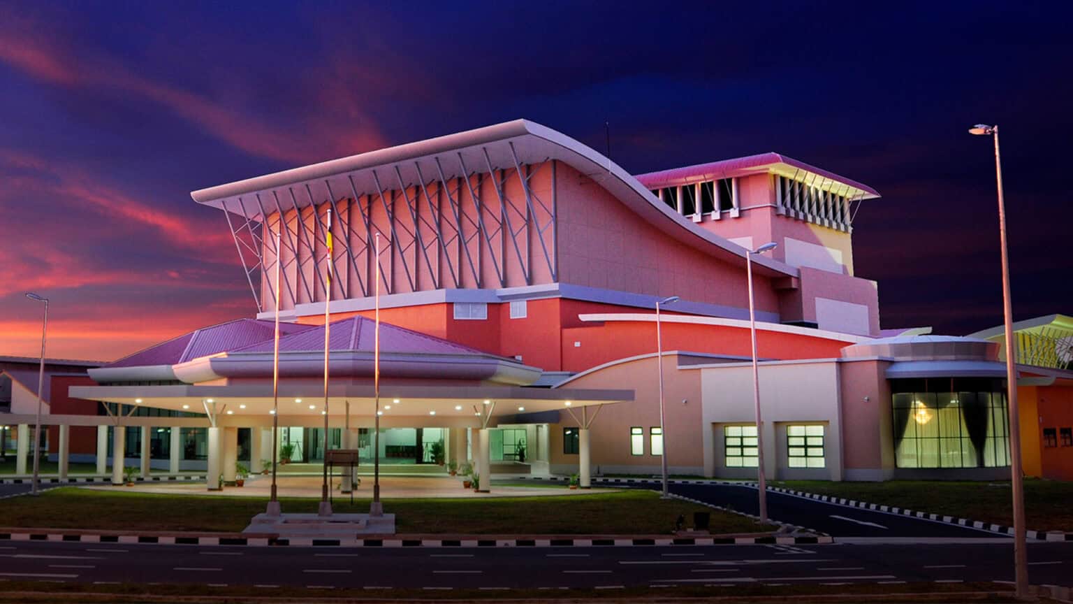 Modern school building with innovative architecture at sunset.