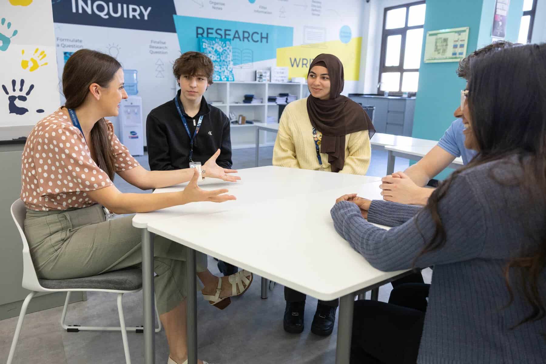 Diverse students engaging in a discussion at a world school.