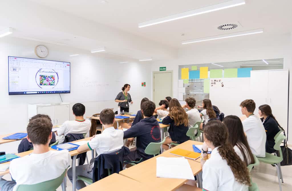 Classroom scene at World Schools with engaged students and a teacher leading a lesson.
