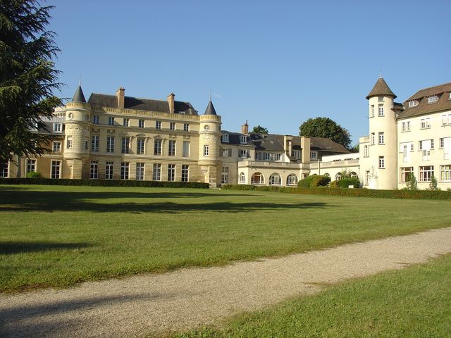 Elegant international school campus with historic architecture and lush green grounds.
