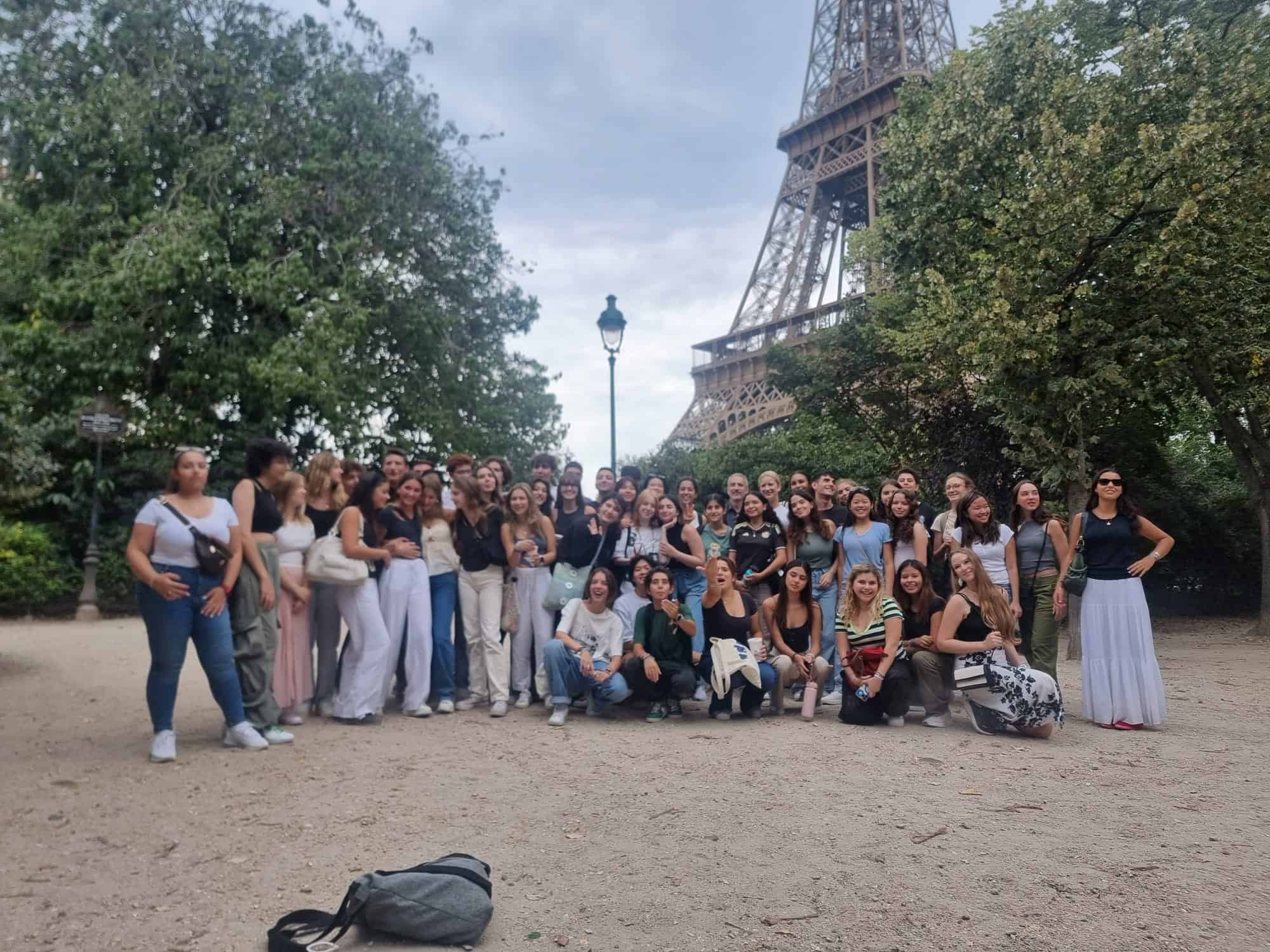 International student group excursion near the Eiffel Tower in Paris, France.