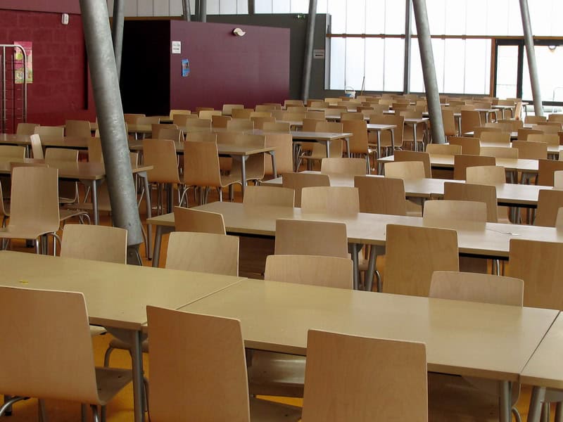 Modern school cafeteria in a spacious, well-lit learning environment for students at international schools.