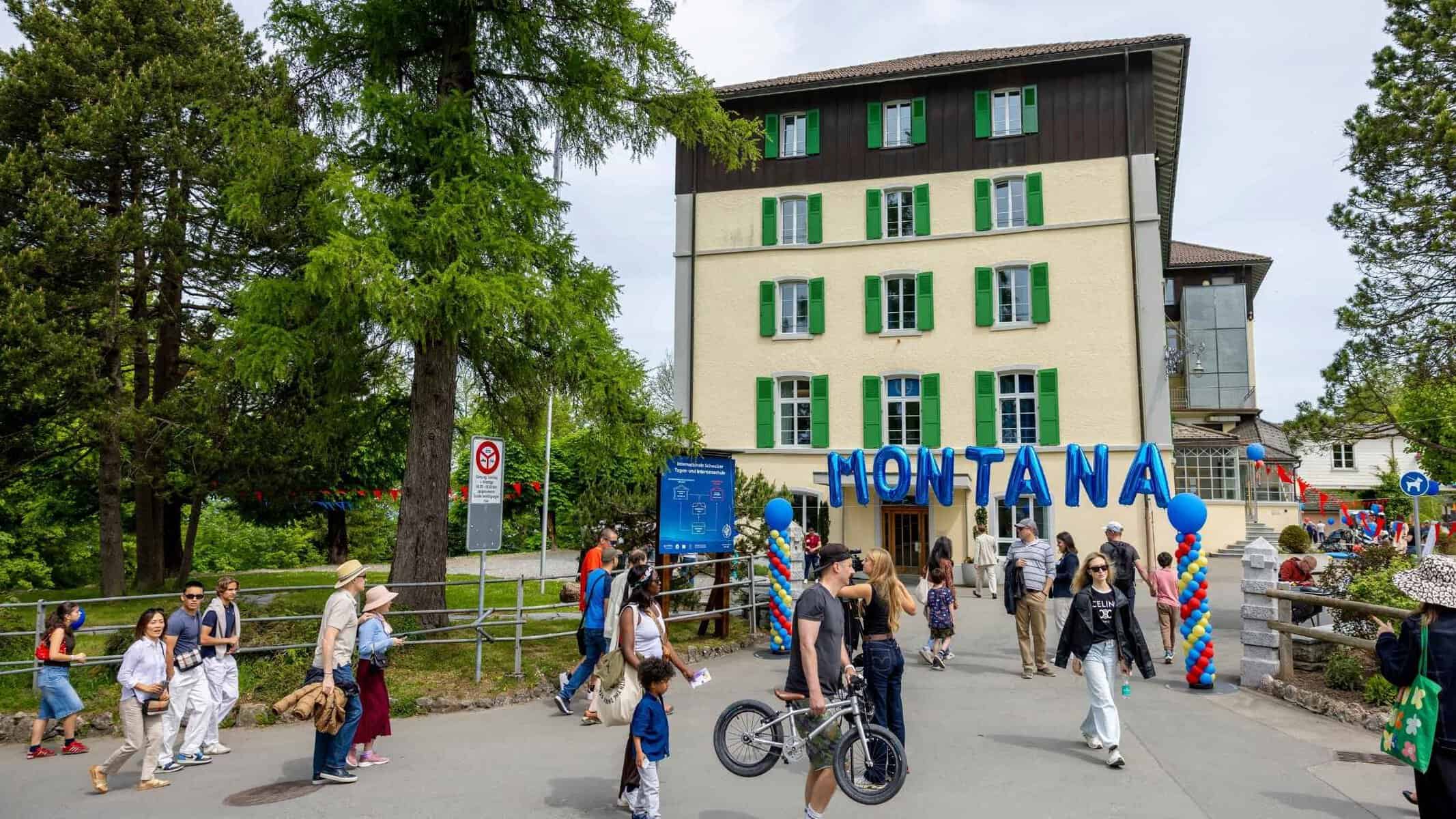Students and staff at the entrance of World Schools campus.