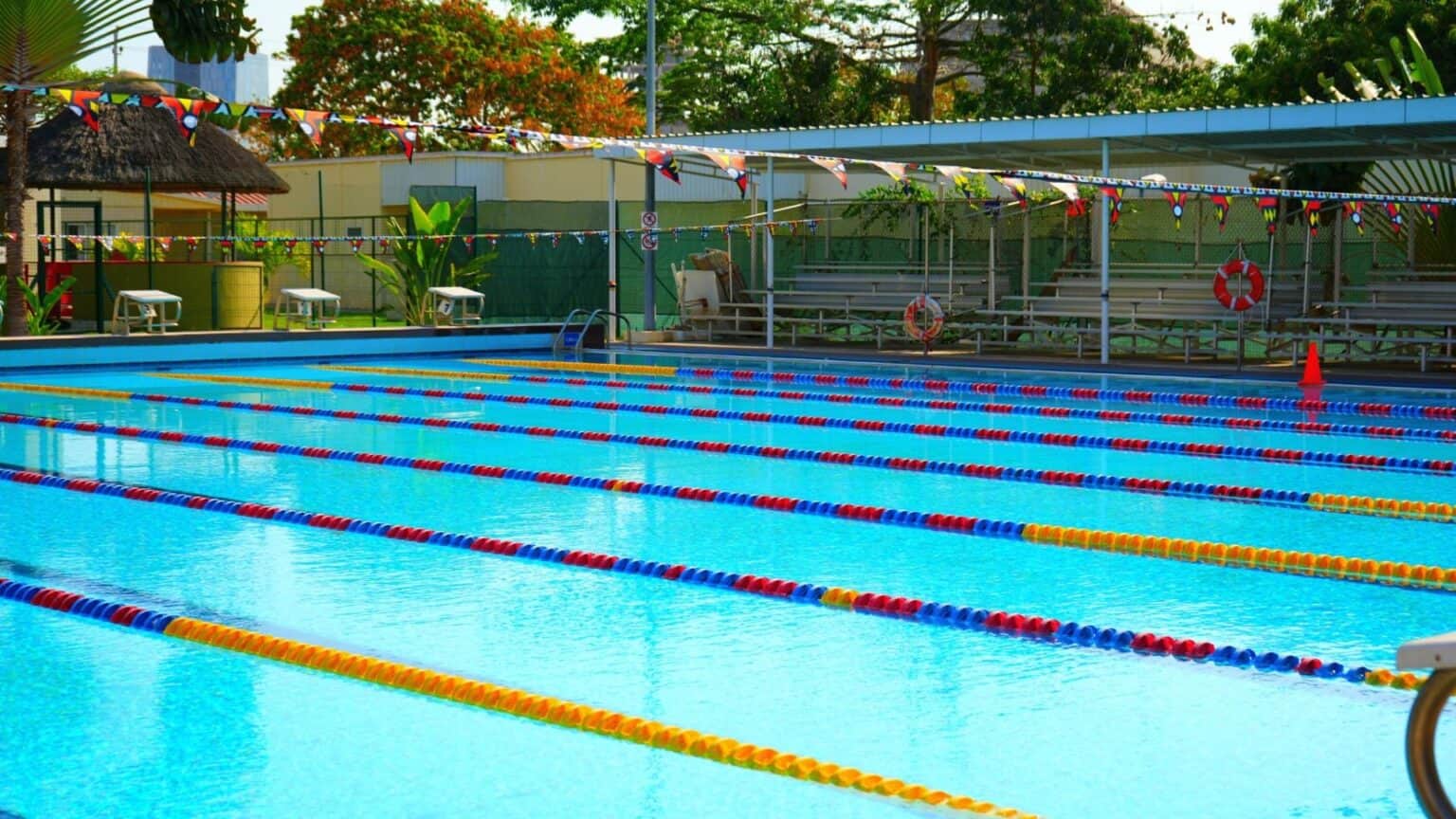 Colorful outdoor swimming pool at a World Schools facility, perfect for sports and recreation.