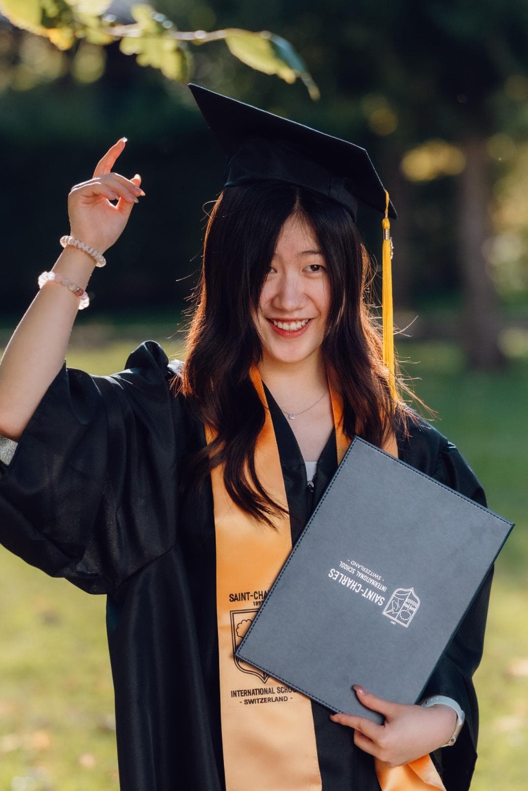 Graduate celebrating achievement at a World Schools event, showcasing excellence in international education.