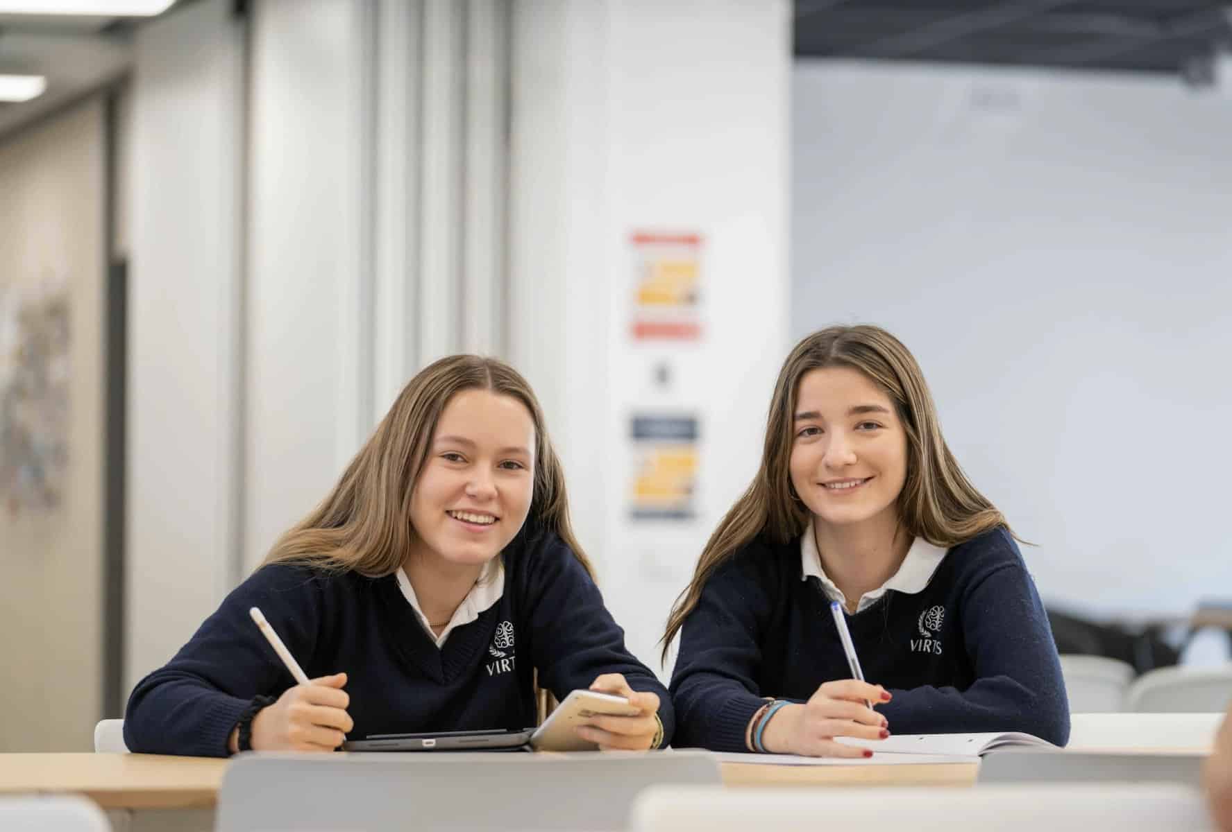 Bright students studying in a modern classroom at a renowned international school.