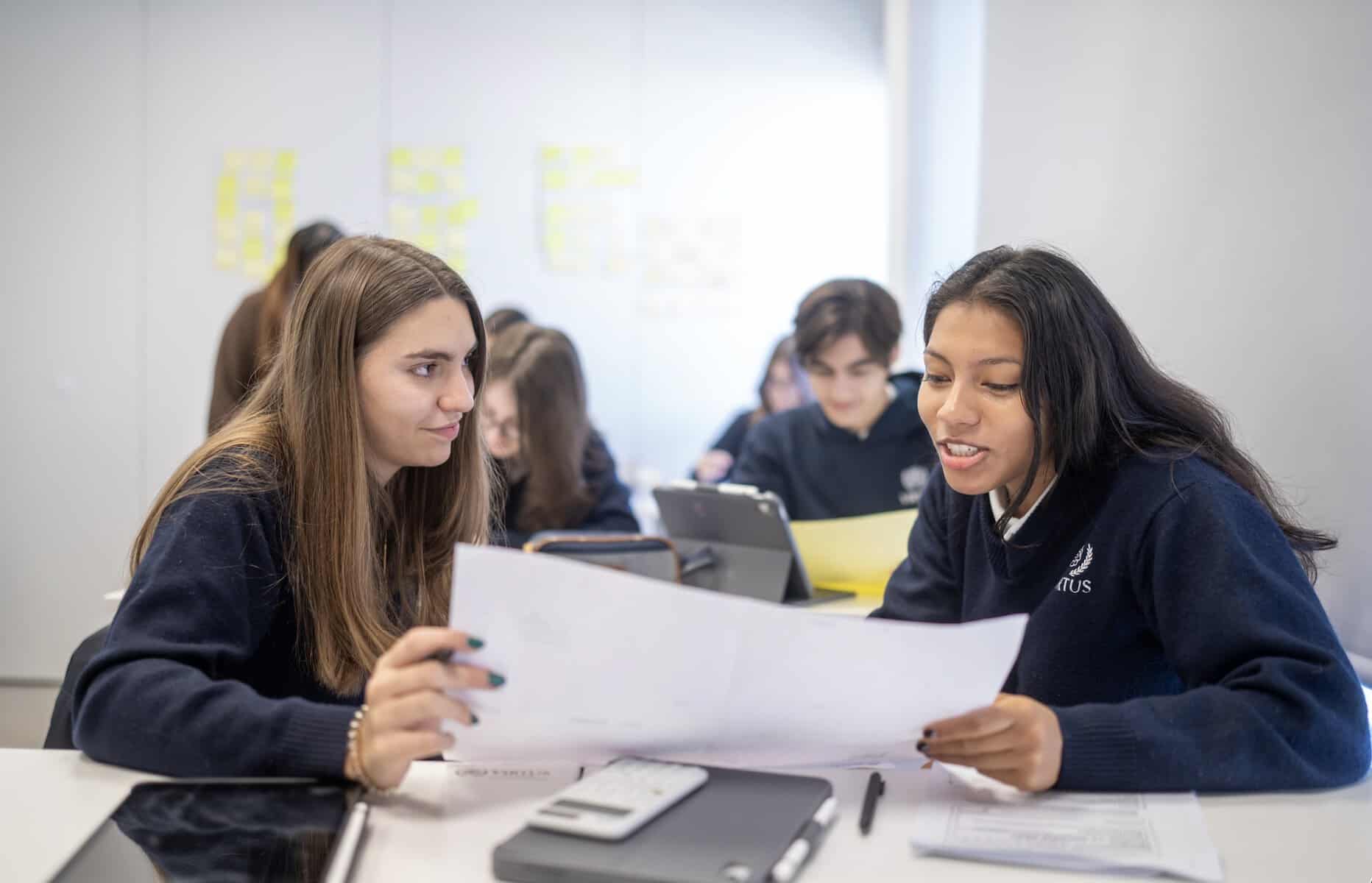 The Added Value of A-Levels: Skills Students Develop 5 Students working together on a project in a classroom setting.